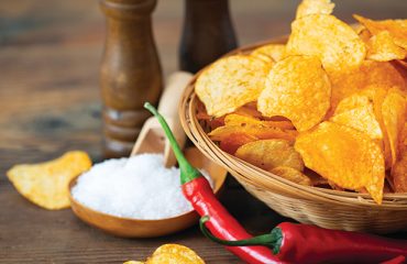 Spicy,Potato,Chips,With,Peppers,In,The,Bowl Spicy,Potato,Chips,With,Peppers,In,The,Bowl