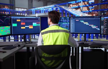 Busy,Logistic,Manager,Analyzes,Warehouse,Data,On,Desktop,Computer,Screen.